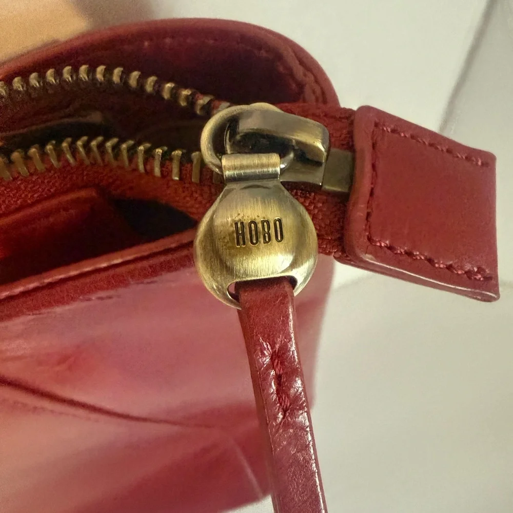 Hobo Cranberry Trapezoid Shoulder Bag w/Zipper Accent Gold Hardware Inner Pocket